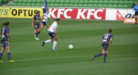 Louisa Bisby (5) of Melbourne Victory surrounded by Perth Glory players including Matildas Kate Gill (12) and Collette McCallum (14)